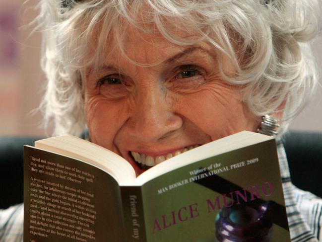 (FILES) Canadian author Alice Munro holds one of her books as she receives her Man Booker International award at Trinity College Dublin, in Dublin, Ireland, on June 25, 2009. Nobel Prize-winning Munro died on May 13, 2024, at the age of 92, Canadian media reported on May 14. (Photo by PETER MUHLY / AFP)