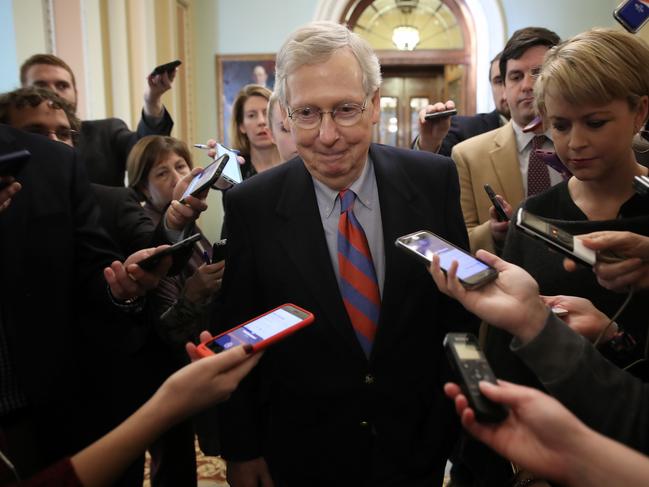 (FILES) In this file photo taken on January 25, 2019, US Senate Majority Leader Mitch McConnell talks with reporters at the US Capitol in Washington, DC. - McConnell, has delivered a rare rebuke of USPresident Donald Trump in legislation set for a preliminary vote Thursday that questions Trump's decision to pull US troops out of Syria. 