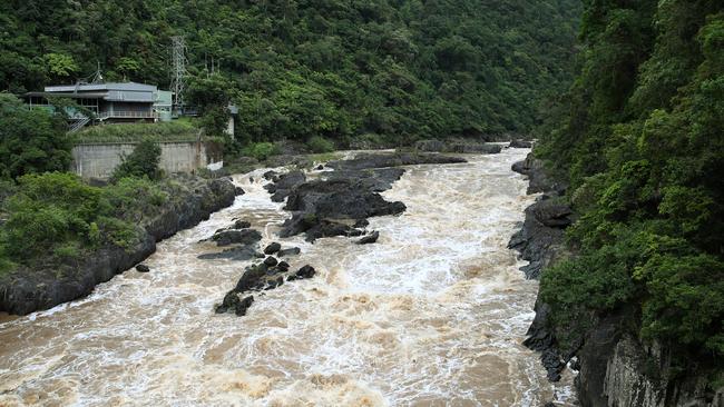 The grey clouds that brought heavy rain to Cairns for the past week are set to hang around, bring more wet weather to the region. The Barron River is in full flow near the hydro-electric station at Caravonica. Picture: Brendan Radke