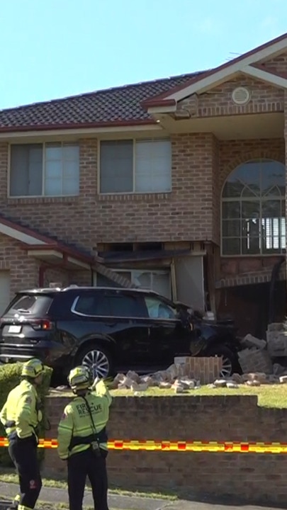 Driver miraculously escapes after car smashes into Sydney home