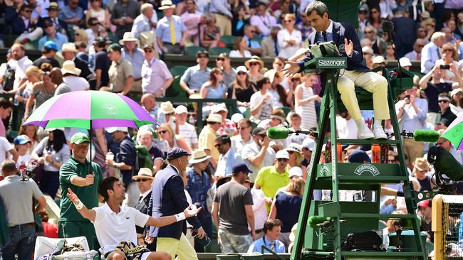 Serbia's Novak Djokovic argues with the chair umpire.