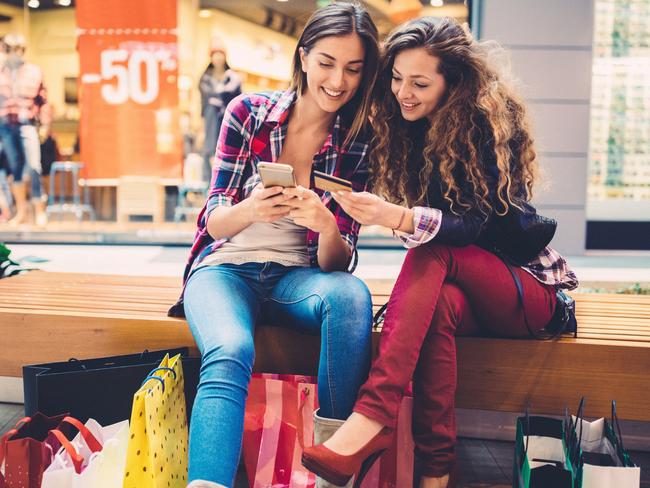 Smiling women shopping online with credit card. Picture: iStock.