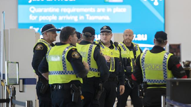 Police prepare for the Jetstar flight JQ 705 to Hobart from Melbourne. Picture Chris Kidd