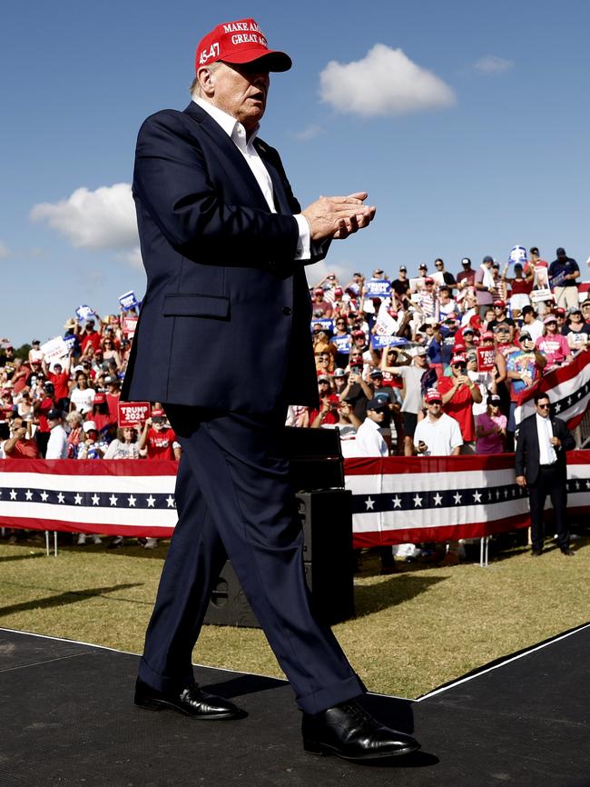 Republican presidential candidate, former U.S. President Donald Trump walks offstafe after giving remarks at a rally at Greenbrier Farms in Chesapeake, Virginia. Picture: Getty Images