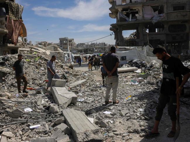 People inspect the damage amid the rubble of a building hit in an Israeli strike in Jabalia in the northern Gaza Strip on May 15. Picture: Bashar Taleb/AFP