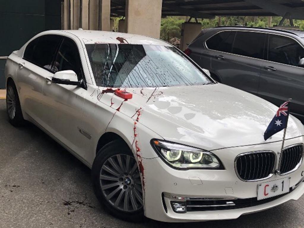 Refugee protesters have thrown red paint on Prime Minister Scott Morrison's car during his visit to the University of Queensland, October 12, 2020. Picture: Twitter via NCA NewsWireSource: https://twitter.com/RSMeanjin/status/1315443573521702914/photo/1