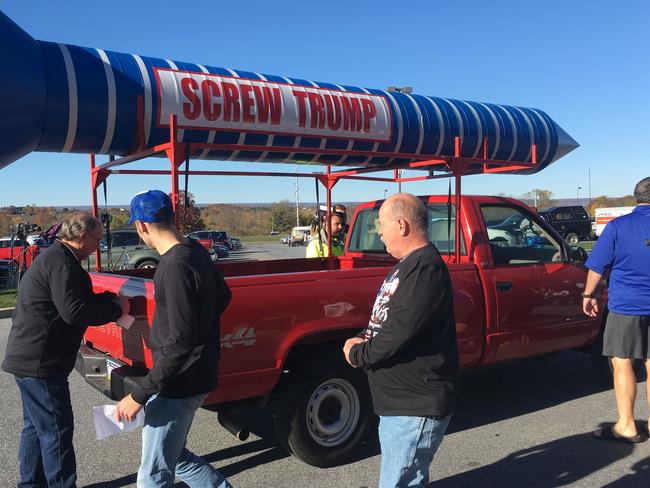 Trump supporters surround a pick-up truck driven by a pro-Clinton protester outside a rally for the Republican nominee in Pennsylvania on November 4. Picture: Michael Mathes/AFP