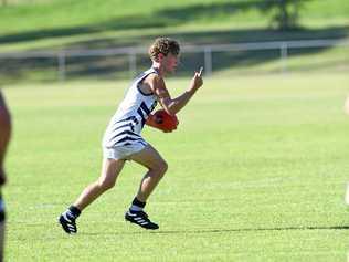 ON THE BALL: Gympie Cats co-captain Jack Cross looks to pass during his side's trial game win over Bay Power on Saturday afternoon. Picture: Troy Jegers