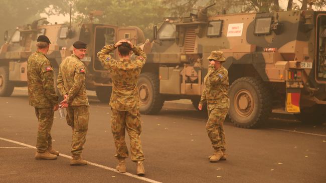 Army personnel on the main street of Buchan. Picture: David Crosling