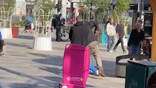 A group brawling in public in St Kilda.