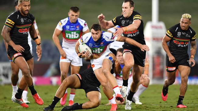 Newcastle fullback Tex Hoy attempts to drive through the Penrith defence during their 14-all draw at Campbelltown Stadium on Sunday evening. Picture: AAP