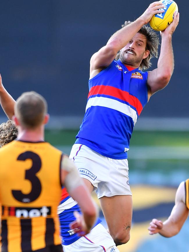 Adelaide, AUSTRALIA – SEPTEMBER 13: Josh Bruce of the Bulldogs marks over Aaron Naughton of the Bulldogs during the round 17 AFL match between the Hawthorn Hawks and the Western Bulldogs at Adelaide Oval on September 13, 2020 in Adelaide, Australia. (Photo by Mark Brake/Getty Images)