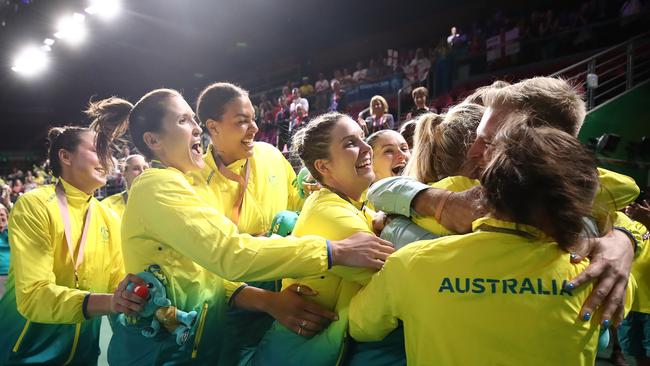 The Opals swarm Nicole Seekamp and her partner Cody Havermann after the proposal. Picture: Getty