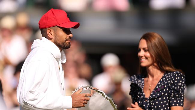 Nick Kyrgios of Australia receives the runner up trophy from Catherine, Duchess of Cambridge