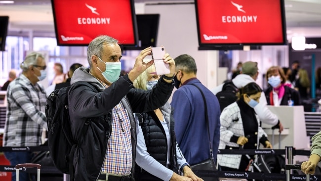 Passengers wearing face masks are seen at the check-in counters at Sydney's Kingsford Smith during the COVID-19 pandemic. Picture: James D. Morgan/Getty Images