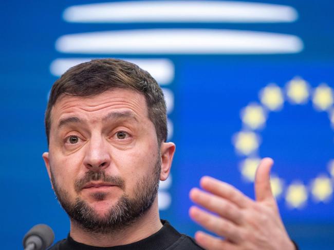 TOPSHOT - Ukraine president Volodymyr Zelensky delivers a speech at a Special European council summit, in Brussels on February 9, 2023. - Hailed as a European hero on his arrival in Brussels, Ukraine's President Volodymyr Zelensky urged EU leaders to accelerate the promised delivery of modern long-range weapons. (Photo by NICOLAS MAETERLINCK / BELGA / AFP)