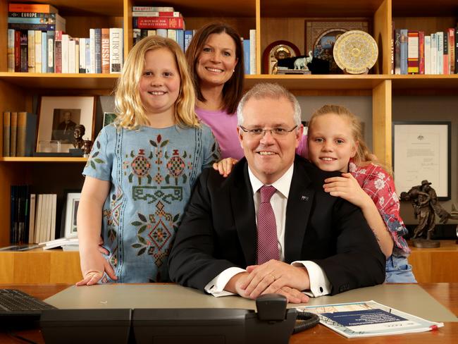 Scott Morrison with his wife Jenny and their daughters Lily and Abbey in his office at Parliament House in Canberra. Picture: Jonathan Ng