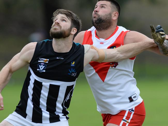 Crib Point defender Tim Cook battles with Karingal’s Marc Holt in 2019. Picture: AAP/ Chris Eastman