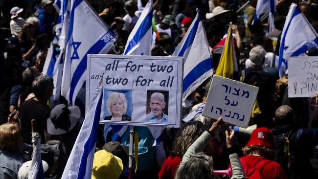 Protesters hold signs with photos of attorney general Gali Baharav Miara and Israel's intelligence Director Ronen Bar during a protest against the Israeli government outside the Prime Minister's office on March 23. Picture: Amir Levy/Getty Images