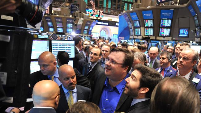 Hoffman at the trading post after the ringing of the opening bell of the New York Stock Exchange in 2011.