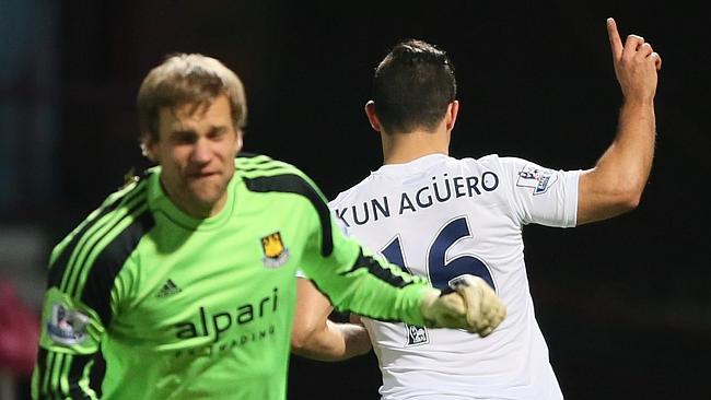 West Ham goalkeeper Jussi Jaaskelainen can only complain as Sergio Aguero scores for City.