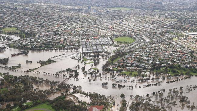 Floodwaters in homes and streets by the Maribyrnong River in Flemington. Picture: David Caird