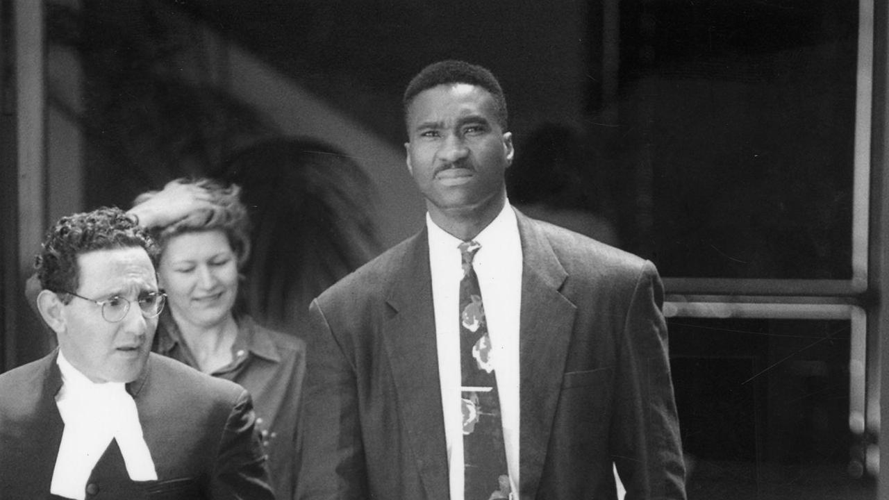 Perth Wildcats basketballer Kendal Pinder (right) leaving the Campbelltown Local Court.