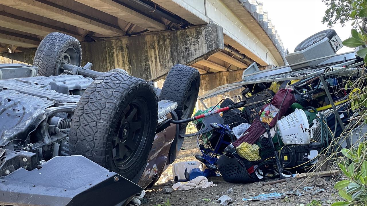 A 4WD towing a trailer northbound on the Bruce Highway crashed through the guardrail at Bakers Creek bridge, south of Mackay. Photo: Janessa Ekert