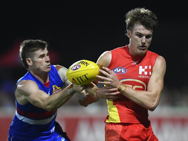 Charlie Ballard of the Suns and Billy Gowers of the Bulldogs contest the ball during the 2019 JLT Community Series AFL match between the Gold Coast Suns and the Western Bulldogs at Great Barrier Reef Arena on March 03, 2019 in Mackay, Australia. Picture: Ian Hitchcock/Getty Images.