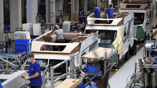 Workers assemble camper vans in Jandelsbrunn, Germany. The country recorded its sharpest increase in manufacturing output in decades. Picture: Reuters