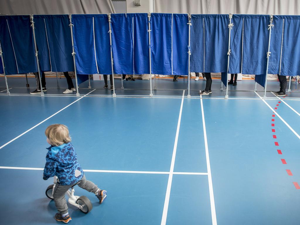 People vote at the Groendal Center in Copenhagen during the European Parliament elections. Picture: Mads Claus Rasmussen/Ritzau Scanpix via AP