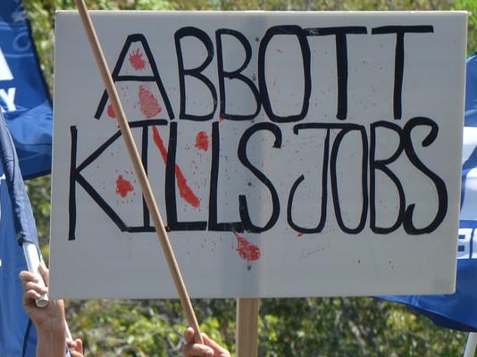 Union members rally against conditions of the China Australia Free Trade Agreement in Darwin. Photo: LACHLAN WILLIAMS/ETU