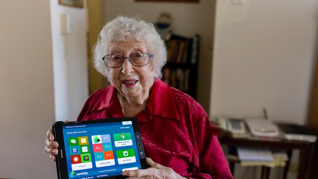 LINKED UP: Carinity Home Care client Beverley Young with her Mobi tablet designed to allow seniors to stay connected during coronavirus.