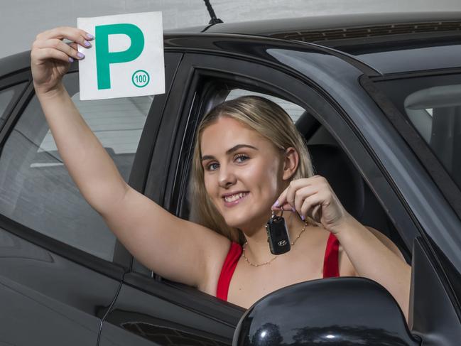 Photo of a girl with a p-plate and a second hand car. Picture: Mark Bean