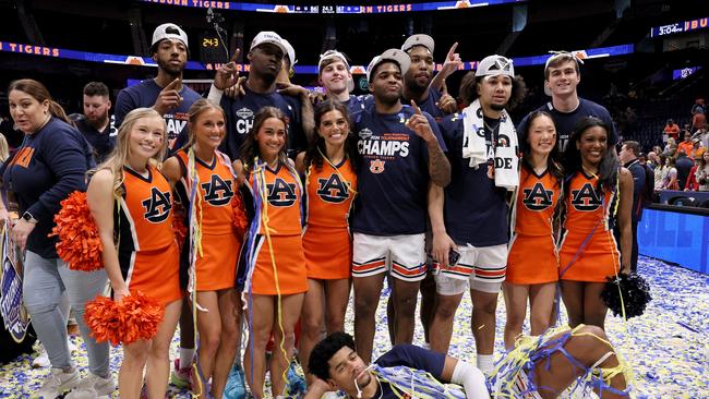 NASHVILLE, TENNESSEE - MARCH 17: The Auburn Tigers celebrate after defeating the Florida Gators in the SEC Tournament Championship game at Bridgestone Arena on March 17, 2024 in Nashville, Tennessee. (Photo by Andy Lyons/Getty Images)