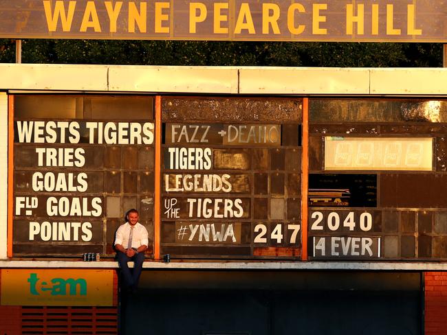 Robbie Farah sits up on the scoreboard drinking beers after the round 26 game against the Raiders. Picture: Gregg Porteous