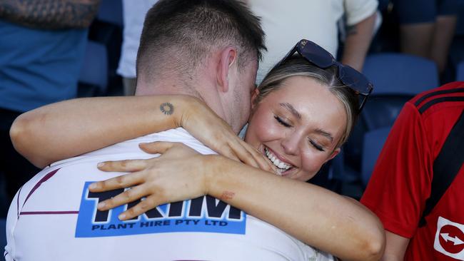 Thirlmere’s Kye Madden embraces his girlfriend Chloe McDonald. Picture: John Appleyard