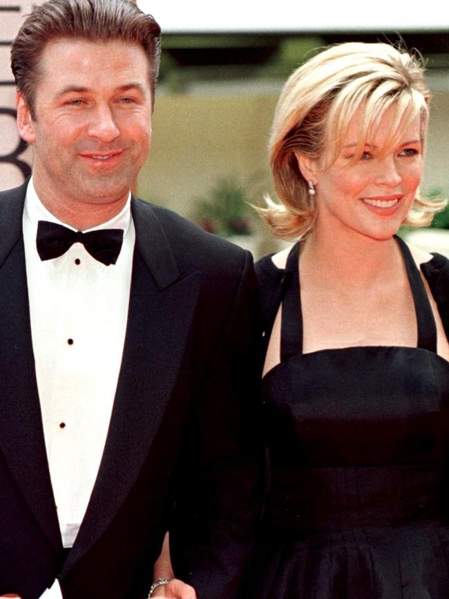 Kim Basinger (R) arrives with her then-husband actor Alec Baldwin. Picture: AFP