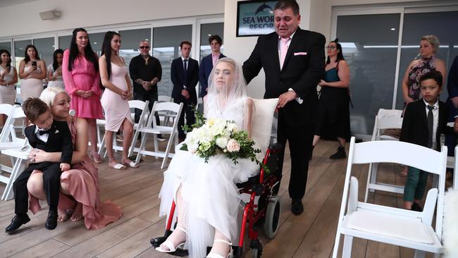 Ashleigh’s father Tony pushing her down the isle. Picture: Jason O'Brien