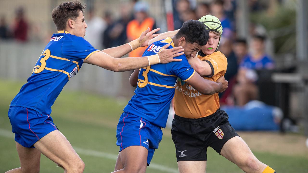 Caleb McCrae tackled by Phoenix Godinet. Picture: Julian Andrews