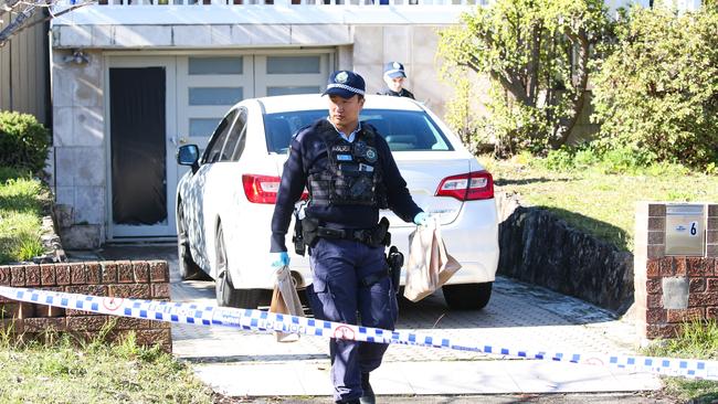 Sunday June 16: Police were seen at the home removing evidence bags after a man was found dead and a woman arrested. Picture: Daily Telegraph/ Gaye Gerard