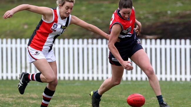 Stephanie Binder and Georgia Hammond battle for the ball.