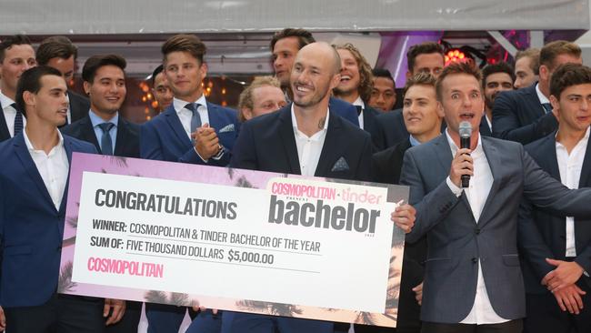 There is nothing sexier than a man with an oversized novelty cheque.