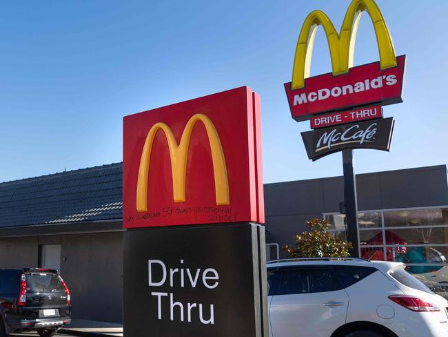 Customers queue up for the "drive-thru" at a McDonald's restaurant on the first day of the easing of restrictions in Wellington on April 28, 2020, following the COVID-19 coronavirus outbreak. - New Zealanders satisfied their cravings for hamburgers and coffee as a five-week lockdown eased on April 28, amid hopes the South Pacific nation has the coronavirus under control. (Photo by Marty MELVILLE / AFP)