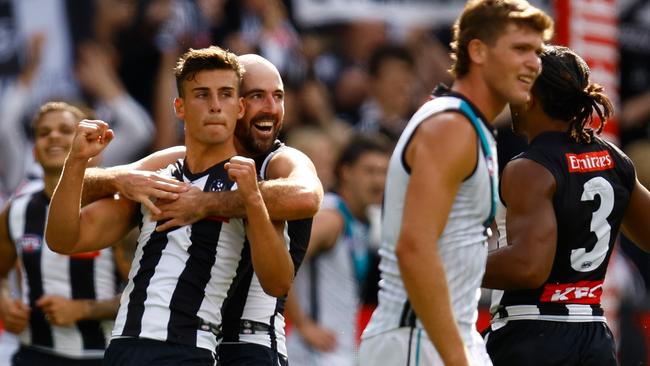 MELBOURNE, AUSTRALIA - MARCH 25: Nick Daicos (left) and Steele Sidebottom of the Magpies celebrate during the 2023 AFL Round 02 match between the Collingwood Magpies and the Port Adelaide Power at the Melbourne Cricket Ground on March 25, 2023 in Melbourne, Australia. (Photo by Michael Willson/AFL Photos via Getty Images)