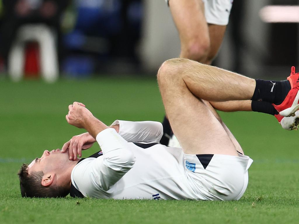 McGovern lies prone after being injured.