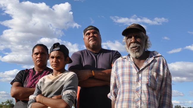 Four generations of Vincent Lingiari descendants. (Left to right) Great granddaughter Selma Smiler, great great grandson Leyton Smiler, grandson Sonny Smiler and son Timmy Vincent. PICTURE: Zach Hope