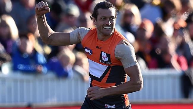 Sam Reid of the Giants celebrates after kicking a goal against Richmond