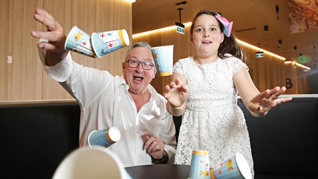 MP Brad Hazzard with Chloe Salotto (9) who designed the winning coffee cup at Northern Beaches Hospital. Picture: Adam Yip / Manly Daily