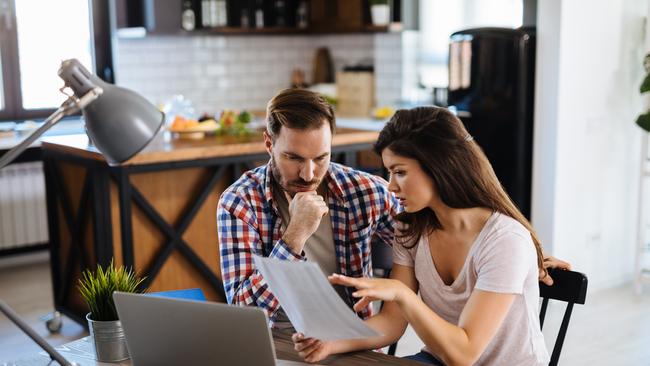 A couple discussing their bills including their mortgage. Picture: iStock.